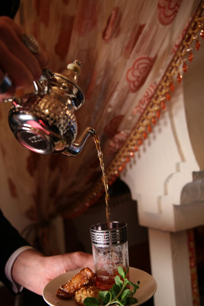 The way pf pouring Morocco mint tea Moroccan Tales: A blog that explores Morocco's culture, traditions, cuisine, and travel.