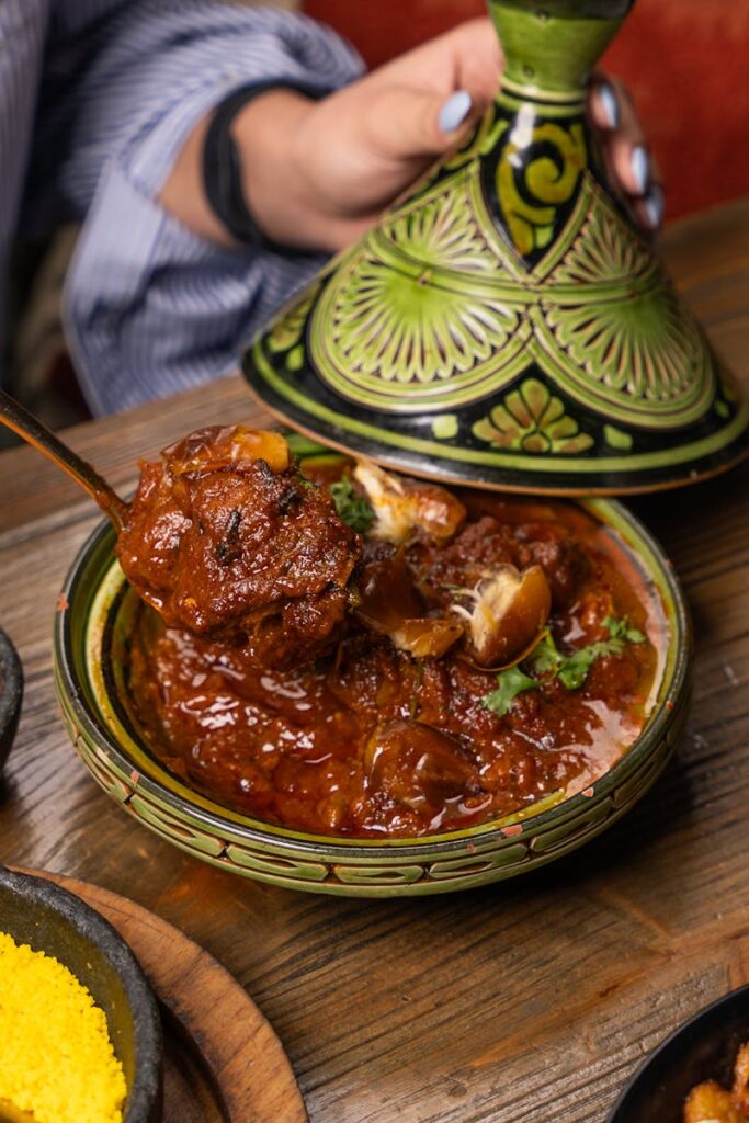 Authentic Moroccan lamb tagine served hot in a traditional dish. Perfect blend of flavors.